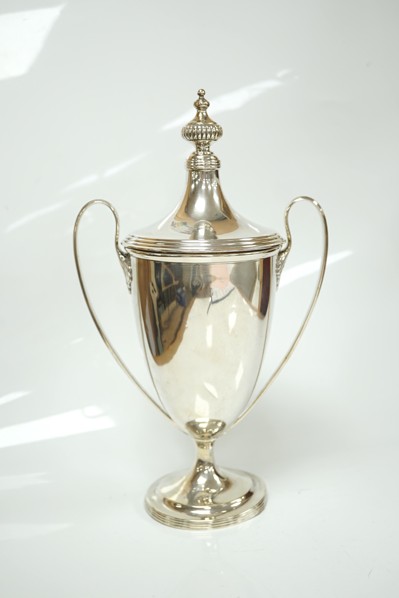 A George V silver two handled presentation trophy cup and cover, 'Dumpton Park Stadium Cup', Edward Barnard & Sons Ltd, London, 1920, 27.8cm, 15.1oz. Condition - poor to fair